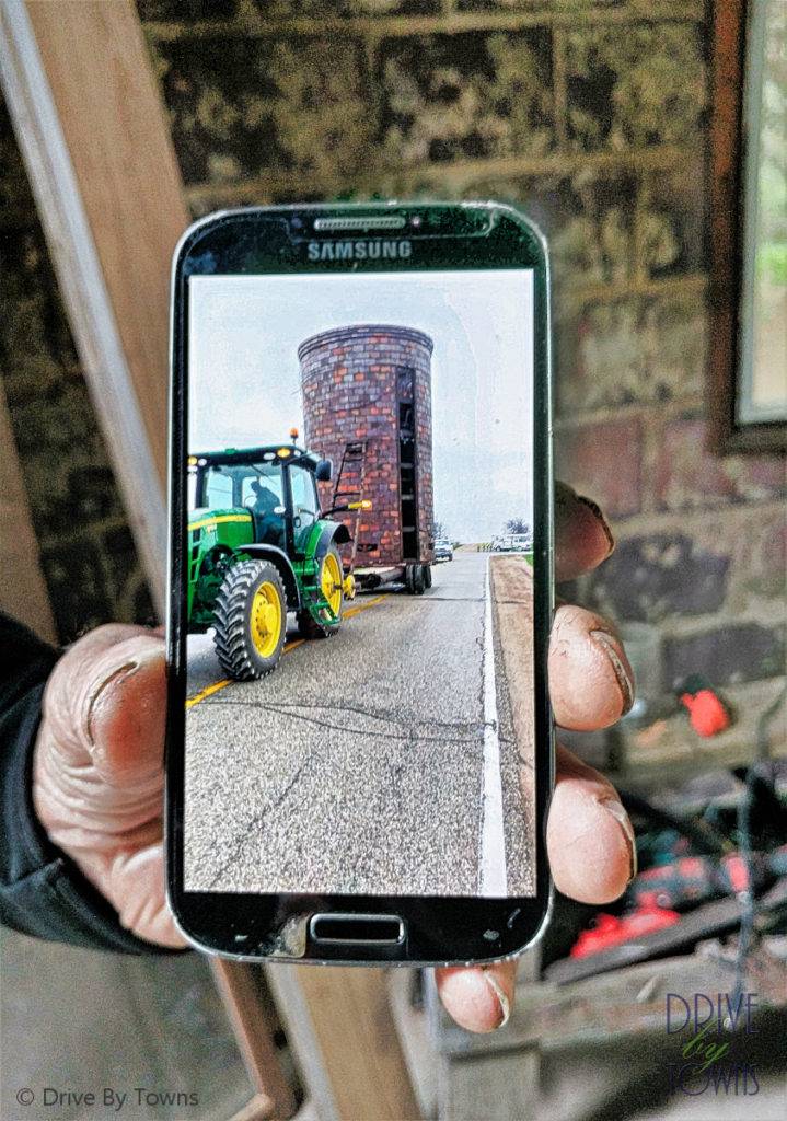 Moving a silo with a tractor