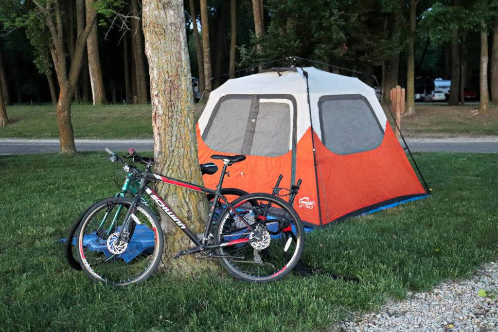 Campsite at Lewis & Clark State Park in Iowa with bikes locked to tree