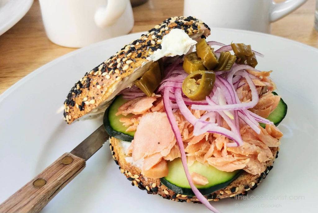 Everything bagel with salmon, cucumber, red onions, and shishito peppers at New Wave Market in Scottsdale, Arizona
