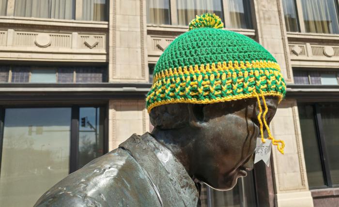 Public art in downtown Wichita - statue with knit hat that's free for anyone who needs it