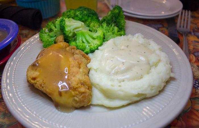 Aunt Bee's Fried Chicken with bacon glaze and a side of mashed potatoes and gravy with steamed broccoli
